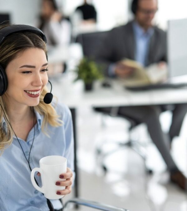 stock-photo-portrait-of-beautiful-young-female-helpline-worker-holding-coffee-mug-having-conversation-with-2258531631-transformed